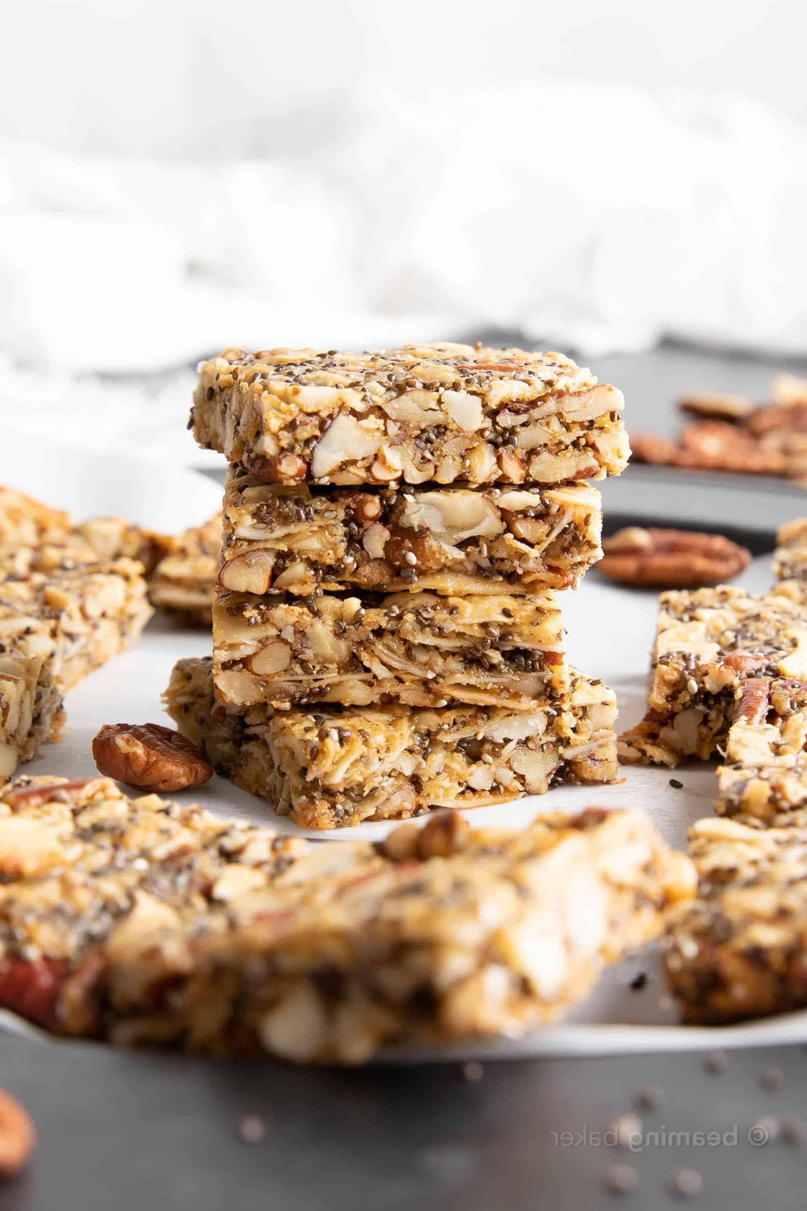 keto granola bars in a stack near more granola bars